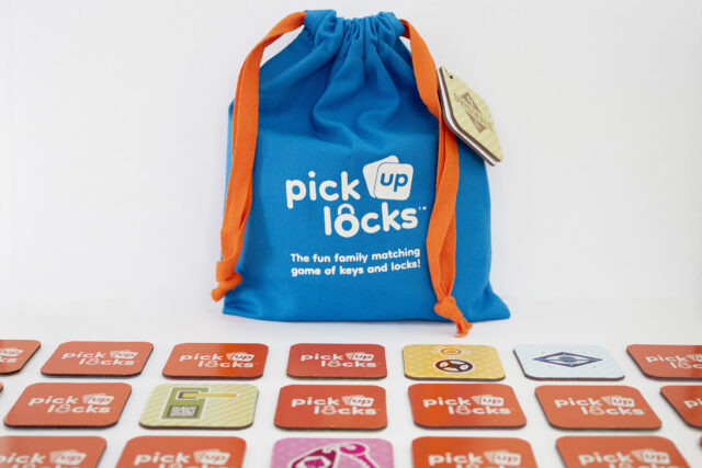 Pick Up Locks Tiles A bag of Pick Up Locks with tiles arranged in a grid in front of it.